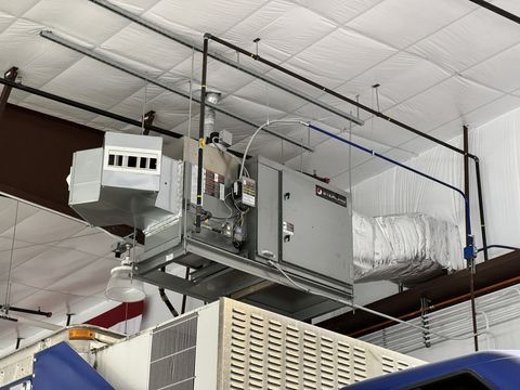 Gas-fired makeup air unit and ductwork overhead