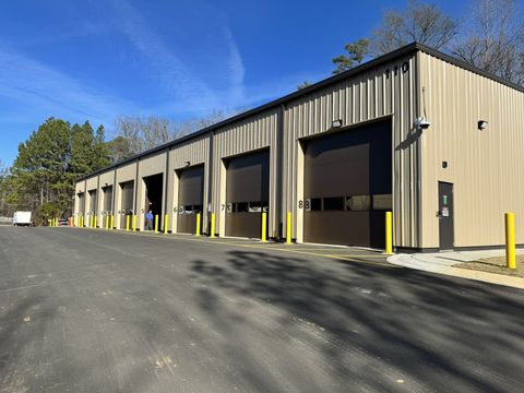 Exterior of the vehicle garage with its row of overhead bay doors